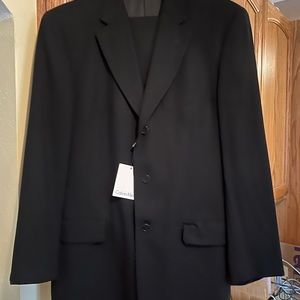 Calvin Klein black suit jacket and matching pants.  Brand new with tags!